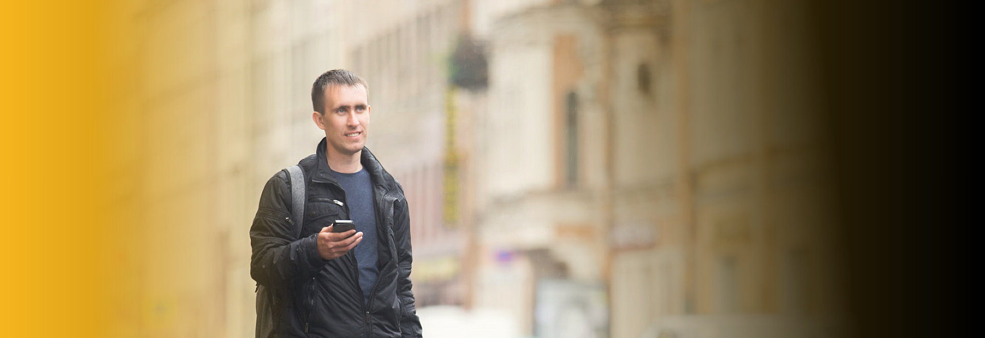 man holding cellular phone